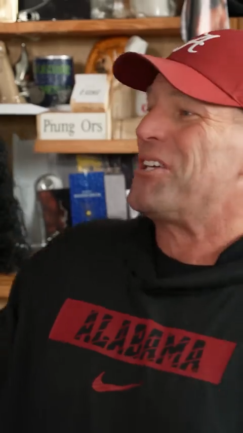 Close-up singer in a desk-band parody clip
